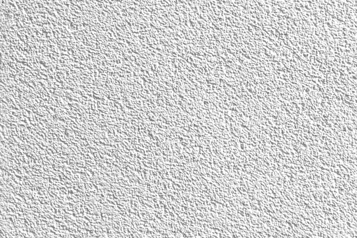 White rough plaster wall texture providing detailed background